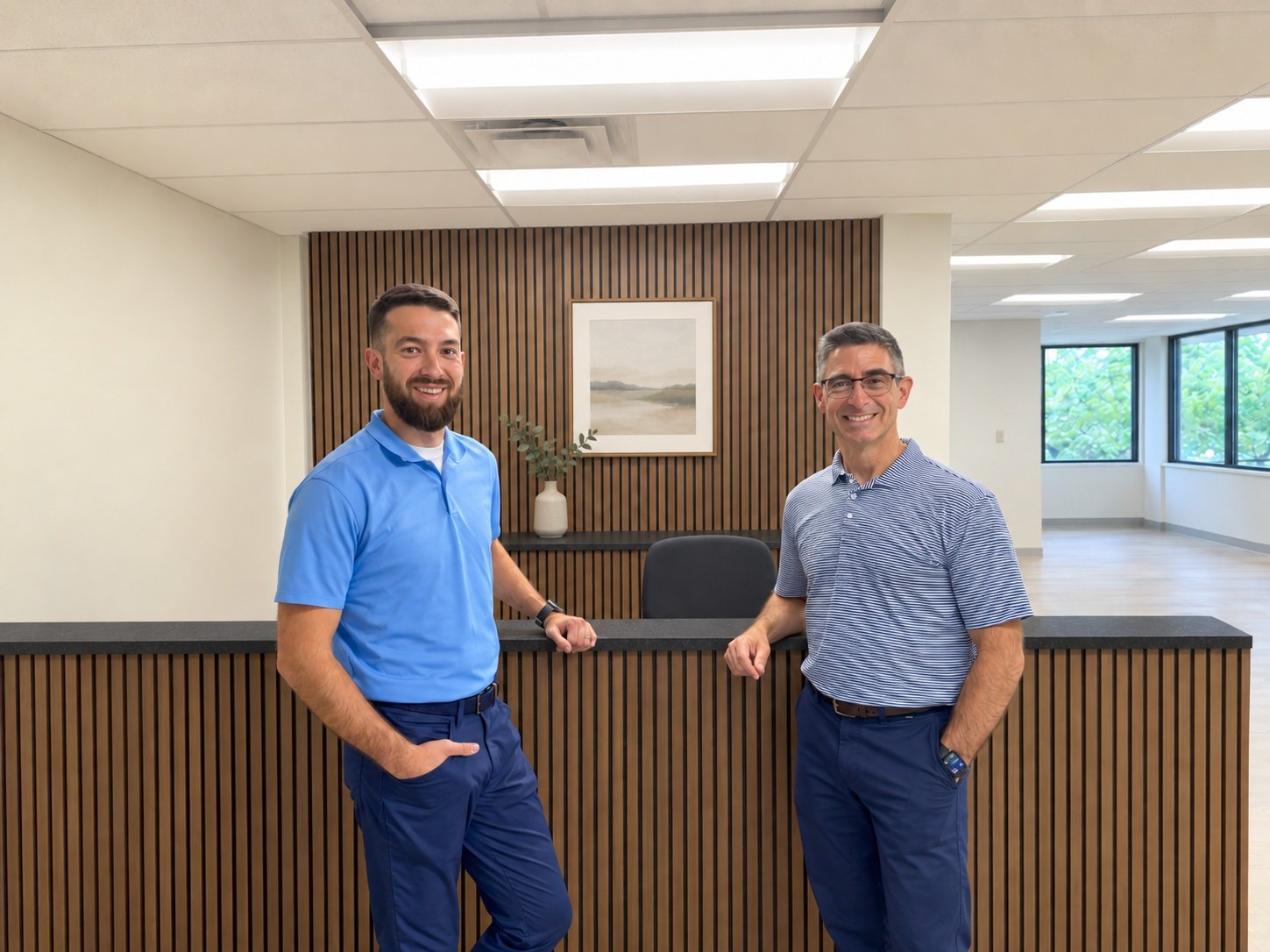 Patrick and Christian Hoban at the clinic front desk